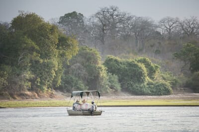 Tanzania Nyerere Sand Rivers Selous family safari boat