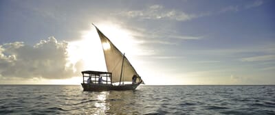 Tanzania Zanzibar andBeyond Mnemba island family safari sunset dhow