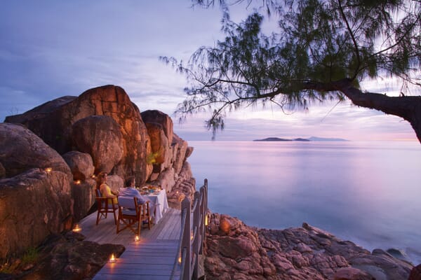 Praslin luxury family holidays - Constance Lemuria dinner on rocks