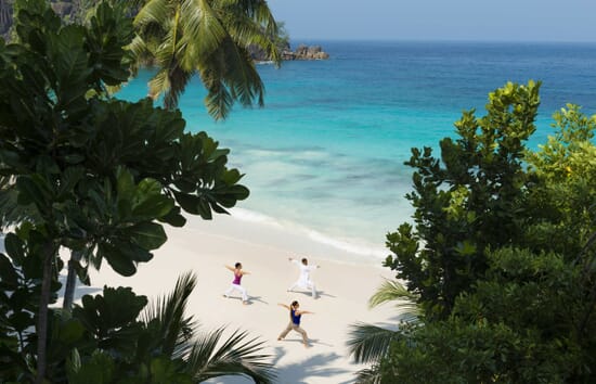 Mahe luxury family holidays - Four Seasons beach yoga