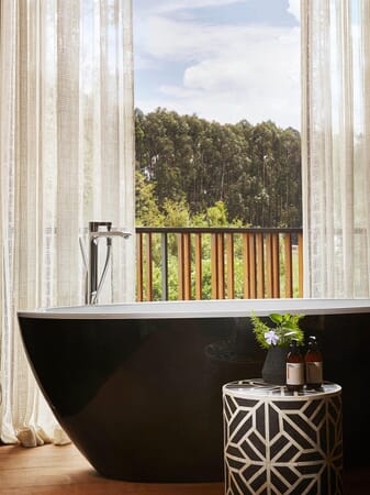 One&Only Gorilla’s Nest Volcanoes National Park Luxury Family Safaris Rwanda Coral Tree Travel